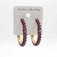 EARRINGS IN GOLD COLOR EITH PURPLE PEARLS